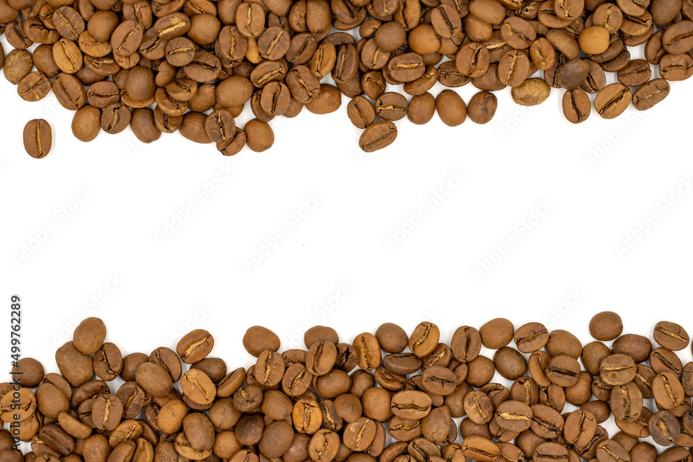 Fototapeta premium Coffee beans isolated on a white background. The middle is left blank as a text area. Close-up. Copy space. Empty space for text. Top view