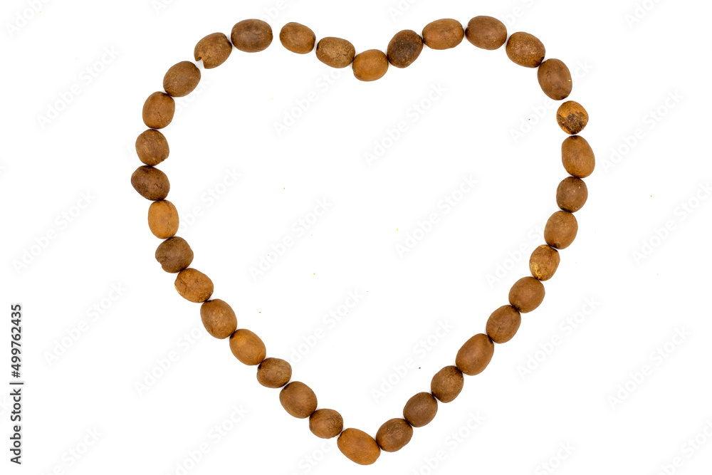 Coffee beans isolated on a white background. Heart shape with coffee beans. Close-up. Top view Coffee beans isolated on a white background. Heart shape with coffee beans. Close-up. Top view
