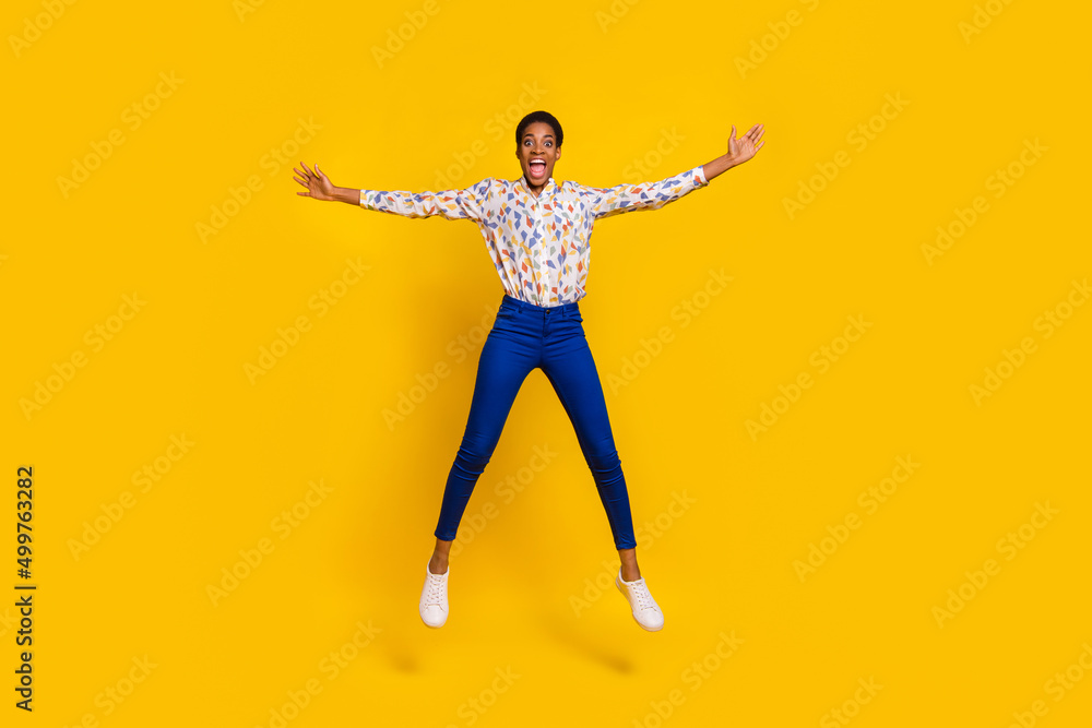 Full length photo of sportive crazy person raise hands make star figure isolated on yellow color background