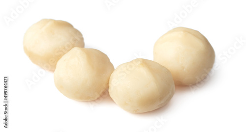 Shelled Macadamia nuts isolated on white background.