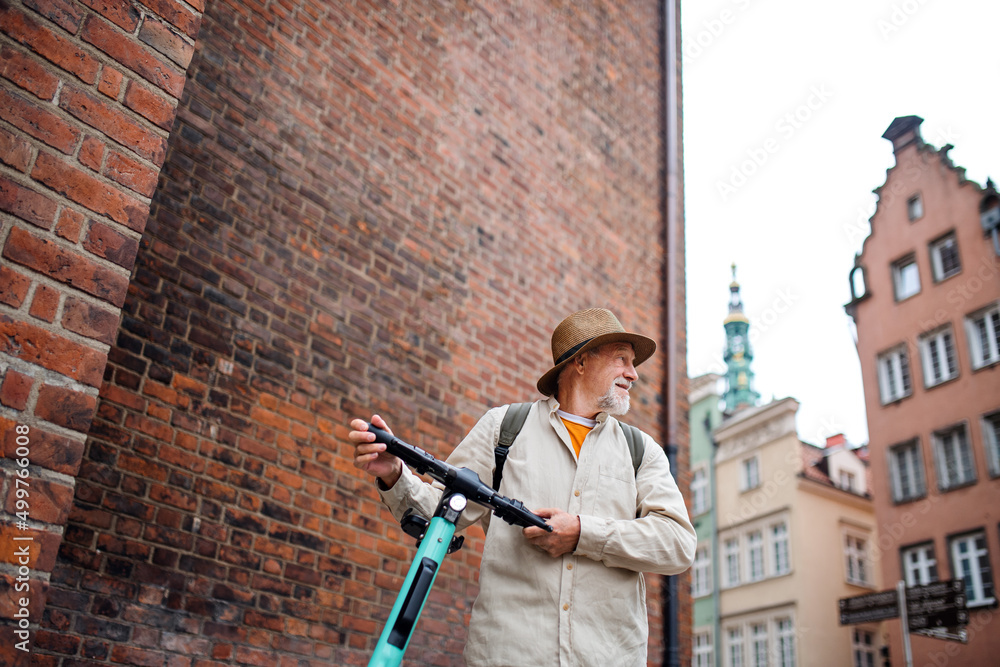 custom made wallpaper toronto digitalPortrait of happy senior man tourist riding scooter outdoors in town