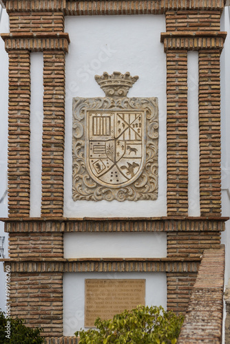 Frigiliana town coat of arms on a building facade