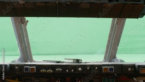 Airplane cockpit windshield with green screen backdrop. photo