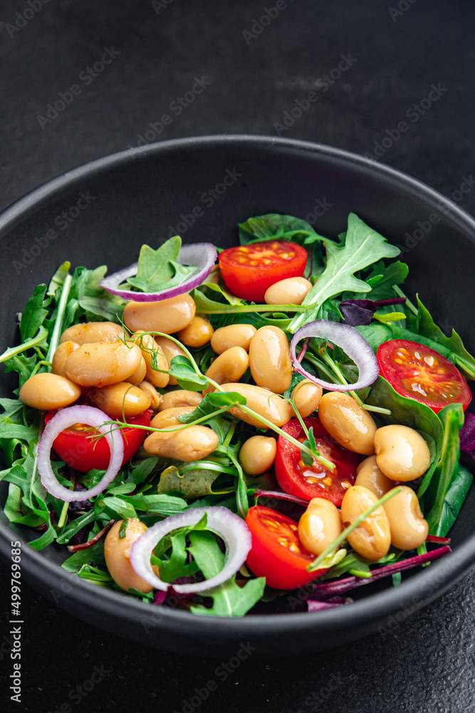 bean salad tomato, onion, lettuce leaves mix fresh healthy veggie meal diet snack on the table copy space food background vegan or vegetarian food