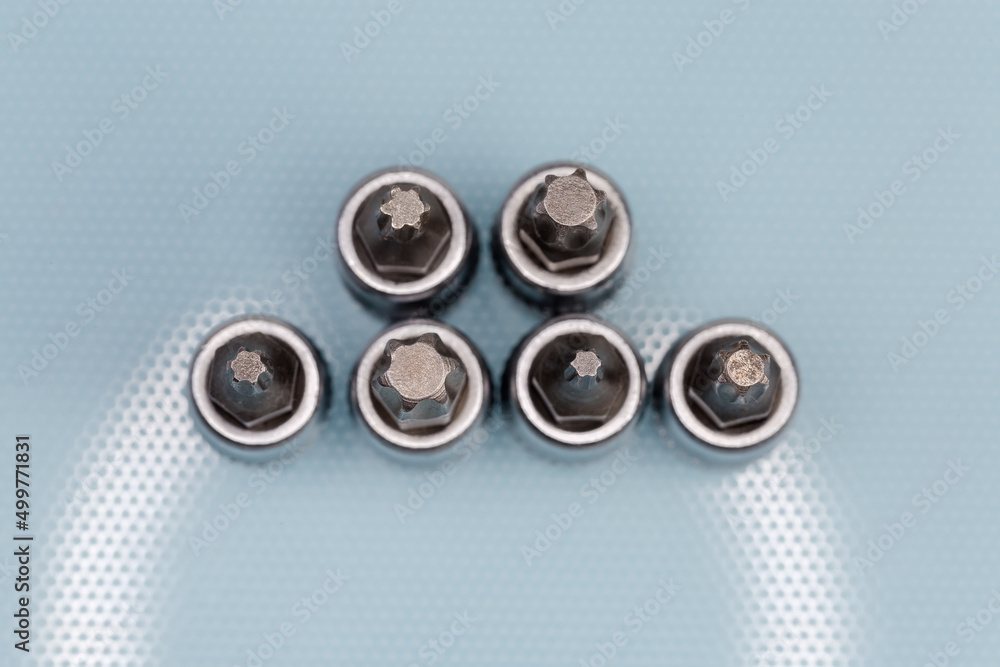 Set of interchangeable torx bits for screwdriver, top view close-up Set of interchangeable torx bits for screwdriver, top view close-up
