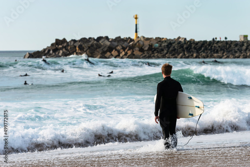 Surfer pondering his entrance to Les Cavaliers Beach. Anglet photo