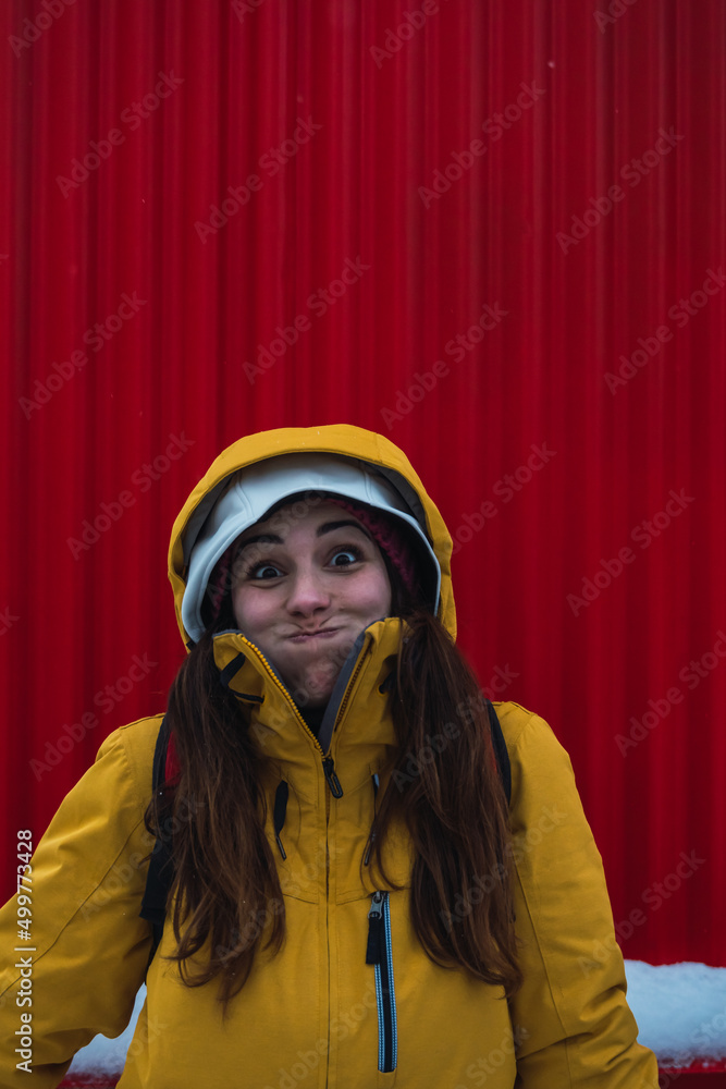 woman facial expression with red background