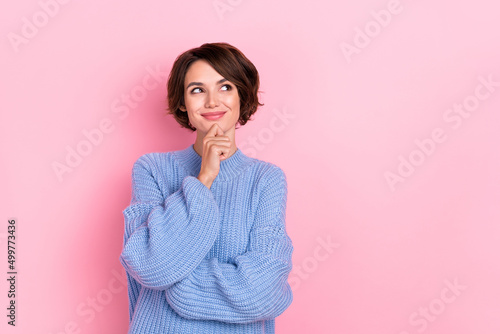 Portrait of pretty positive minded lady hand on chin look interested empty space isolated on pink color background