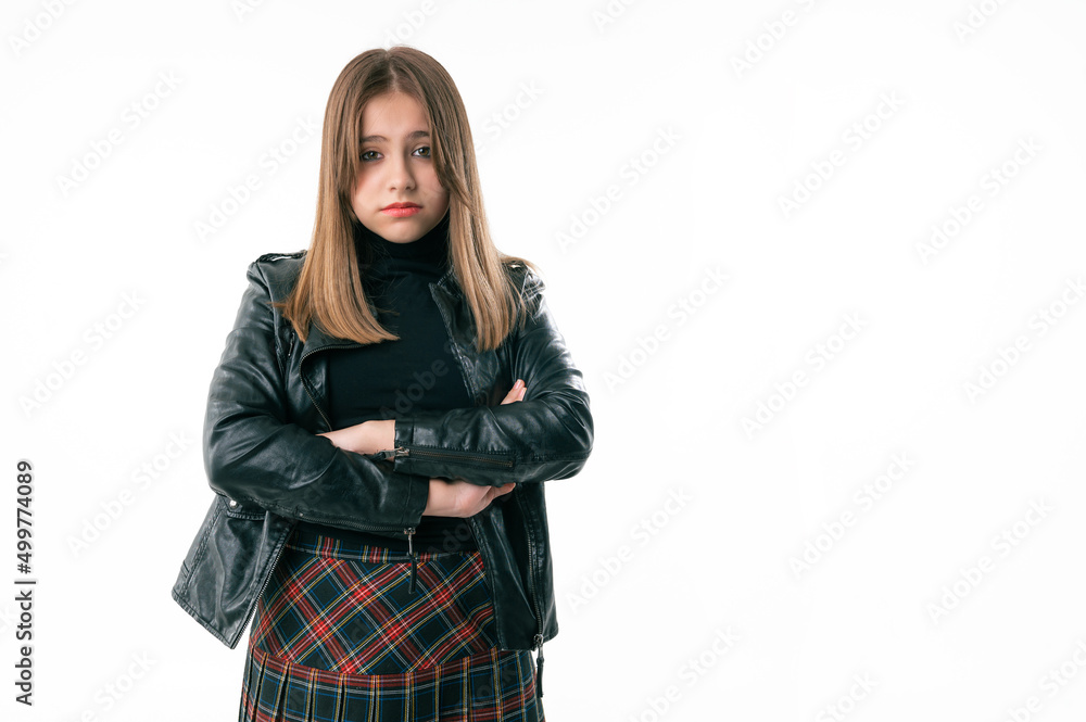 Studio portrait of a cheerful teenage girl. Beautiful teenage girl is standing on a white background Studio portrait of a cheerful teenage girl. Beautiful teenage girl is standing on a white background
