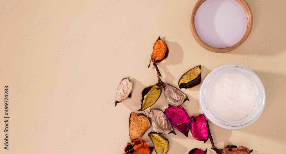 Natural organic eco cosmetics. Handcrafted. Homemade creme in glass container with herbal and flower ingridients. flat lay Natural organic eco cosmetics. Handcrafted. Homemade creme in glass container with herbal and flower ingridients. flat lay