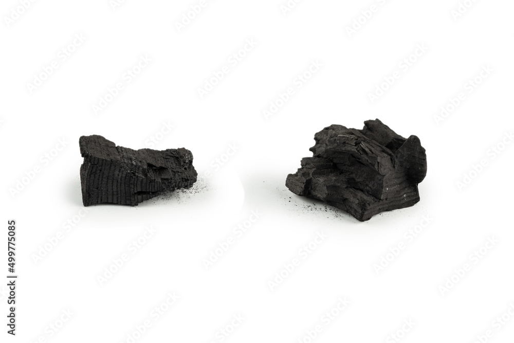Obraz premium Black oak coal isolated on white background.