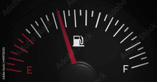 Image of fuel gauge moving over black background