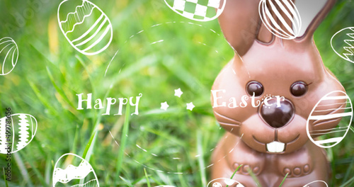 Image of happy easter over chocolate bunny