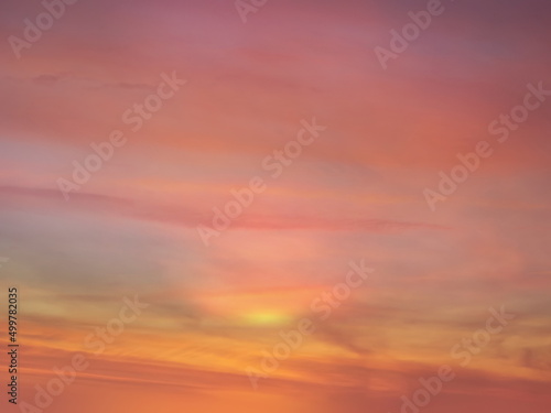 beautiful pink sunset at sea  water reflection sun light on  gold yellow  clouds sky  nature background © Aleksandr