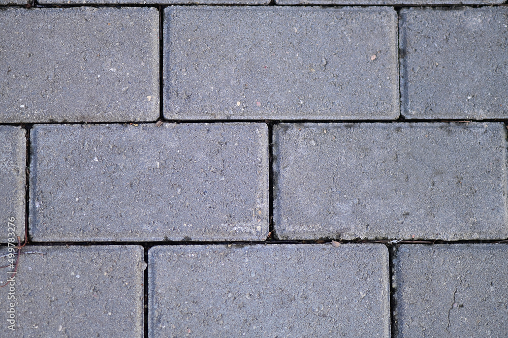 The texture of the sidewalk with paving slabs, top view. paving stones. The texture of the sidewalk with paving slabs, top view. paving stones.