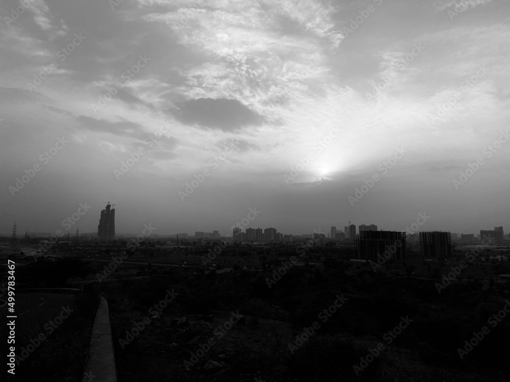 black and white  photography of sunset or sunrise in the city