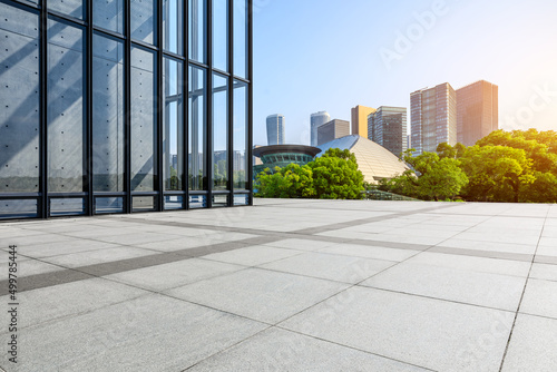 Fototapeta Naklejka Na Ścianę i Meble -  Empty square floor and city skyline with modern commercial buildings in Hangzhou, China.