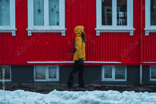 Obraz na płótnie Woman walks alone through the streets of Iceland. w salonie