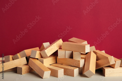 Blocks of wood on red background  Strategy game as a business plan for team work