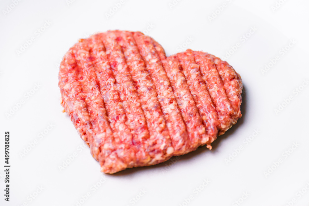 Meat cutlet in the shape of a heart. Dinner for lovers on February 14th. Meat love. Valentine's Day. Mince heart Meat cutlet in the shape of a heart. Dinner for lovers on February 14th. Meat love. Valentine's Day. Mince heart