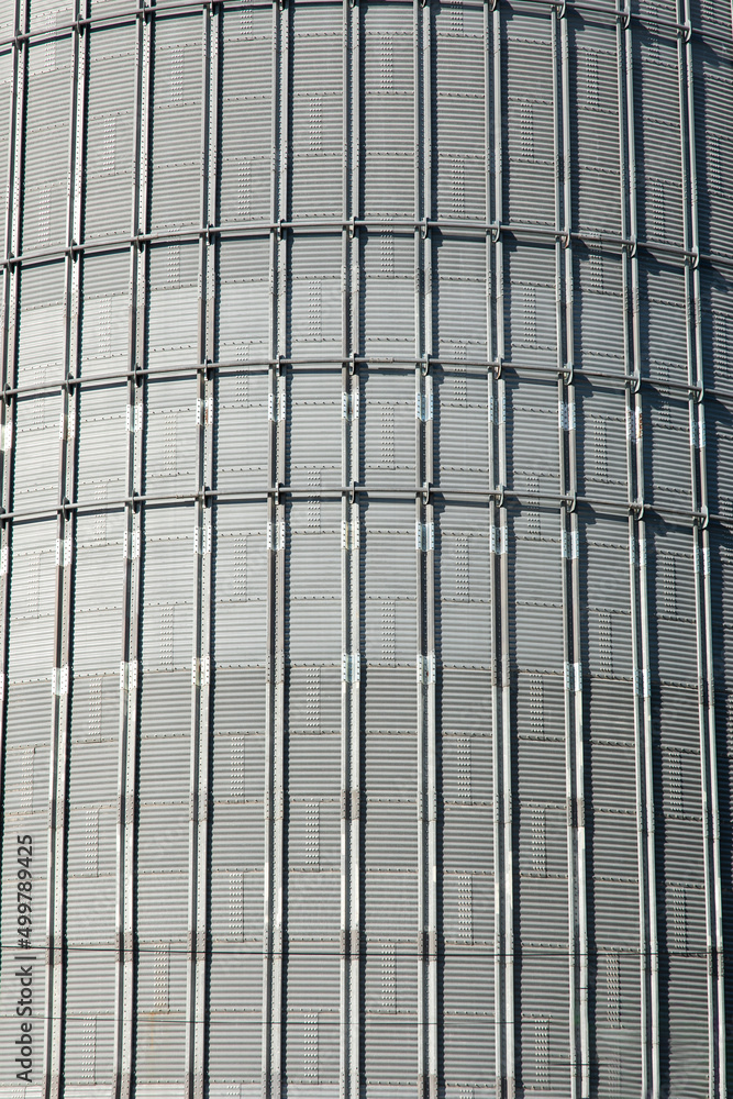 Silo wall metal sheet texture background. Agricultural silo or warehouse building exterior container storage concept image. Silo wall metal sheet texture background. Agricultural silo or warehouse building exterior container storage concept image.