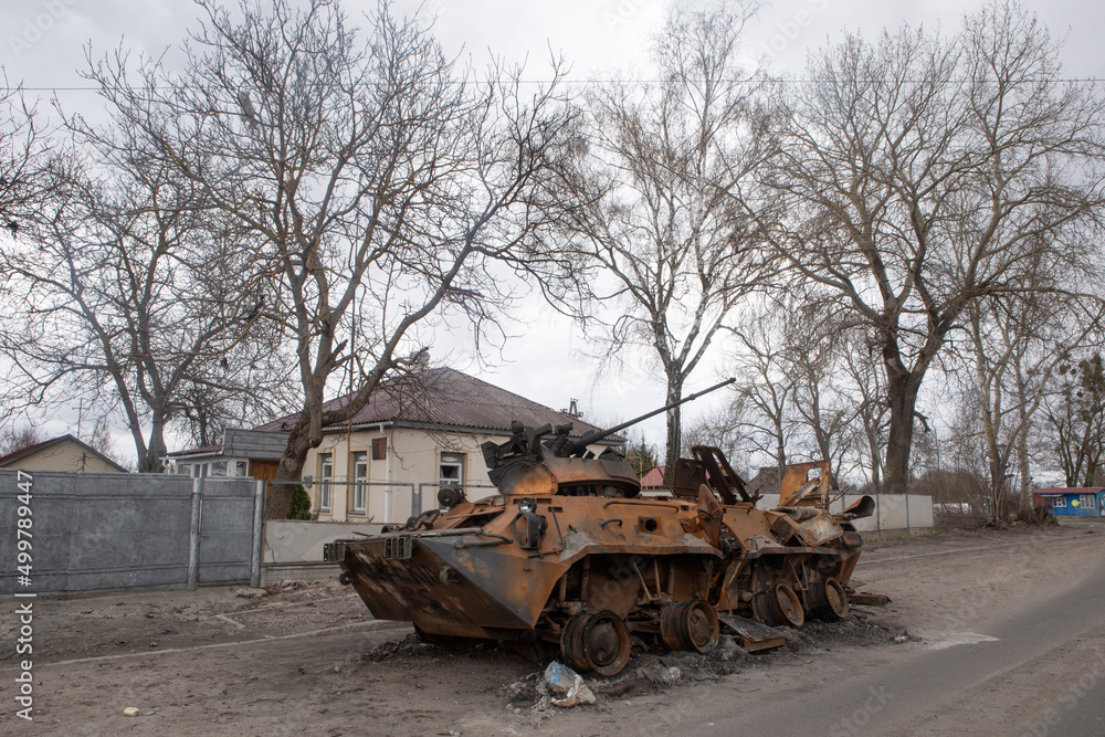 Obraz premium Russian infantry fighting vehicle (BMP) in the village of Brovarsky district, Kiev region. Footage after the battle of Ukrainian and Russian soldiers