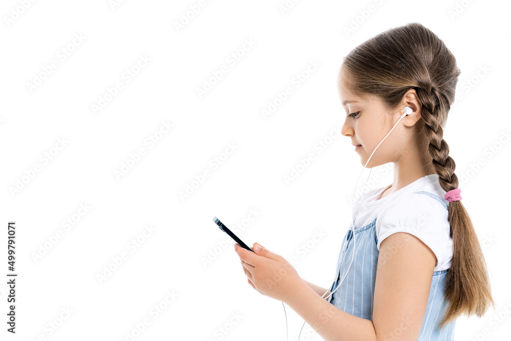 side view of girl in earphones using smartphone isolated on white with copy space. side view of girl in earphones using smartphone isolated on white with copy space.