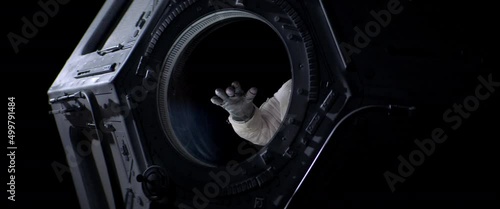 Portrait of Caucasian female astronaut flying towards spaceship cupola window. Space exploration, Mars mission. Shot with 2x anamorphic lens photo