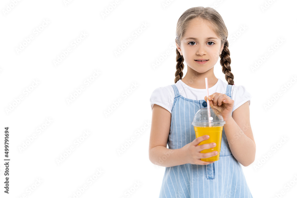 girl with braids and plastic cup with orange juice looking at camera isolated on white. girl with braids and plastic cup with orange juice looking at camera isolated on white.