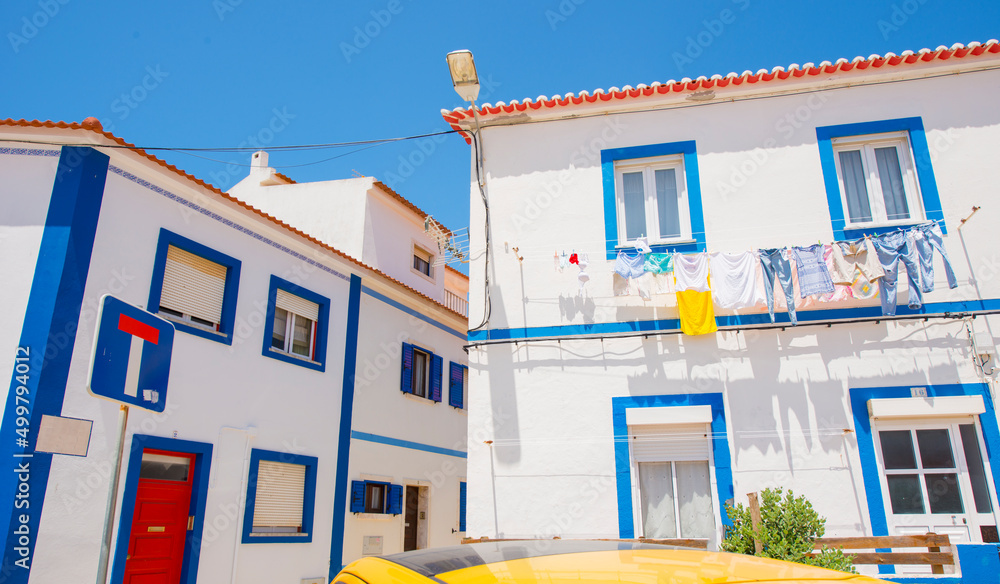 Fototapeta premium colorful houses and streets of sunny cozy Ericeira