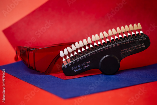 a scale for checking the color of teeth in close-up. Cosmetic dentistry © abramov_jora