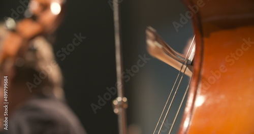 Cello in orchestra. Musician playing Cello