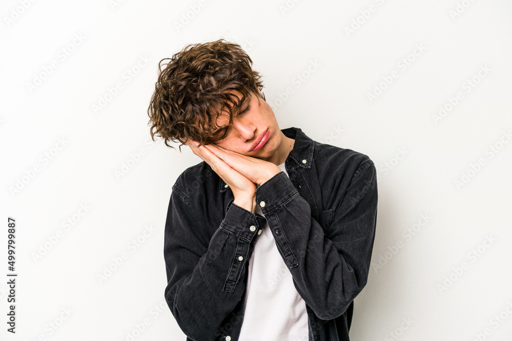 Young caucasian man isolated on white background yawning showing a tired gesture covering mouth with hand. Young caucasian man isolated on white background yawning showing a tired gesture covering mouth with hand.