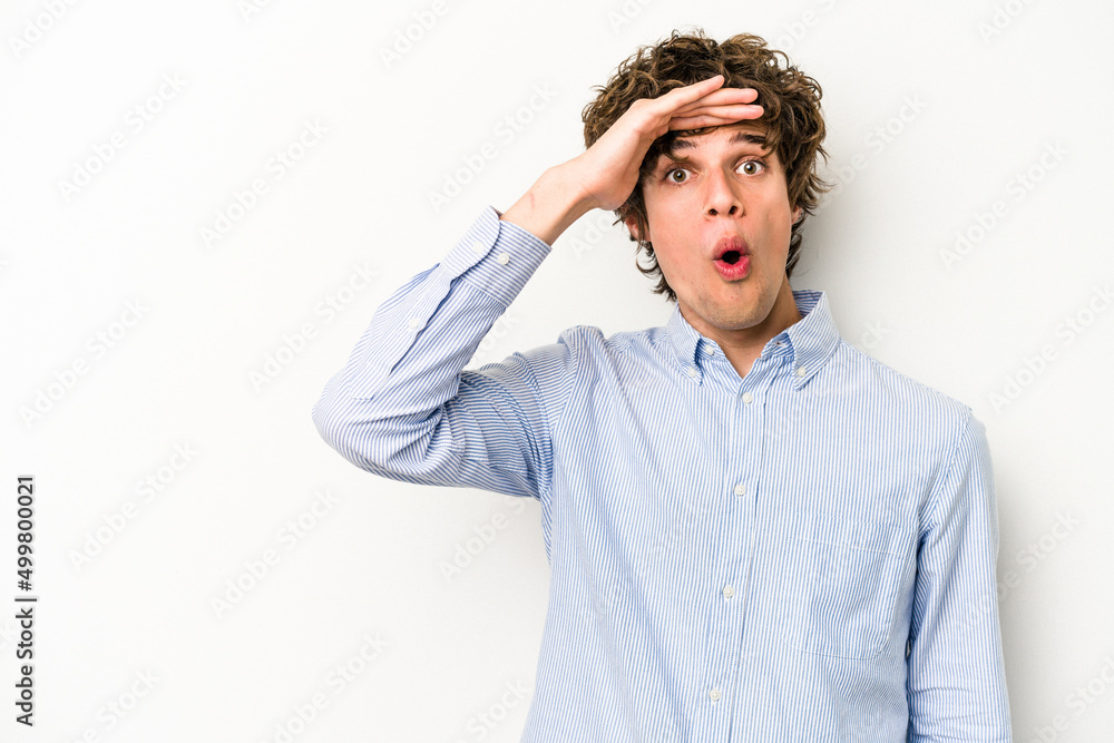Young caucasian man isolated on white background looking far away keeping hand on forehead. Young caucasian man isolated on white background looking far away keeping hand on forehead.