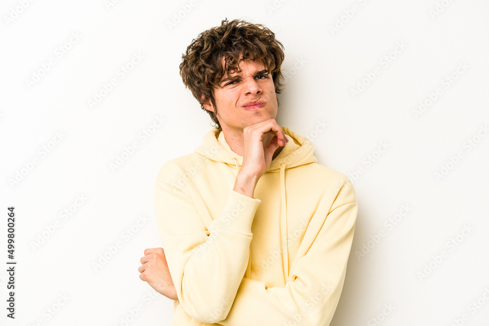 Young caucasian man isolated on white background thinking and looking up, being reflective, contemplating, having a fantasy. Young caucasian man isolated on white background thinking and looking up, being reflective, contemplating, having a fantasy.