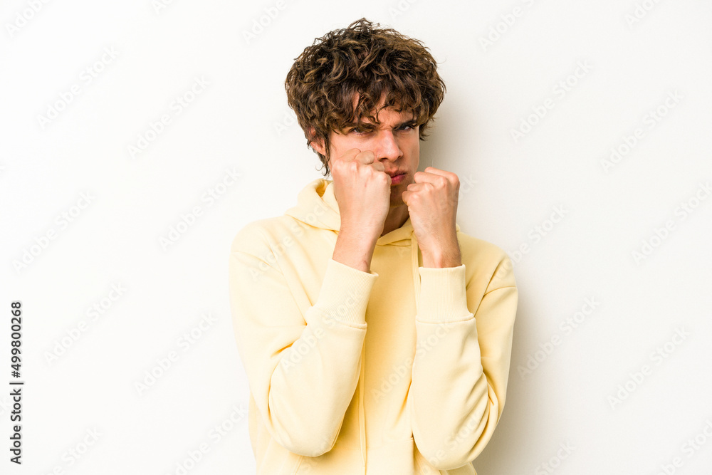 Young caucasian man isolated on white background throwing a punch, anger, fighting due to an argument, boxing. Young caucasian man isolated on white background throwing a punch, anger, fighting due to an argument, boxing.