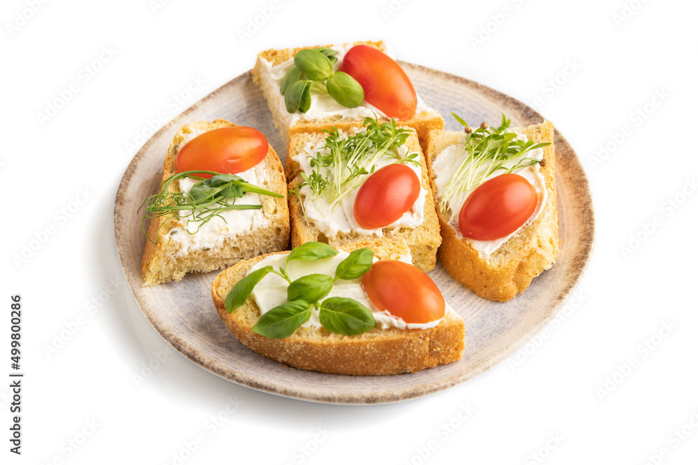 White bread sandwiches with cream cheese, tomatoes and microgreen isolated on white. Side view.