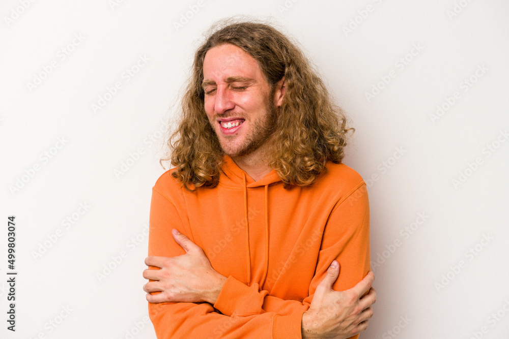 Young caucasian man isolated on white background laughing and having fun. Young caucasian man isolated on white background laughing and having fun.