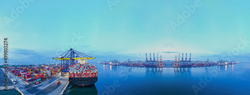 Aerial drone Rear view cargo container ship. Logistics Industrial Container Cargo freight ship for international order concept