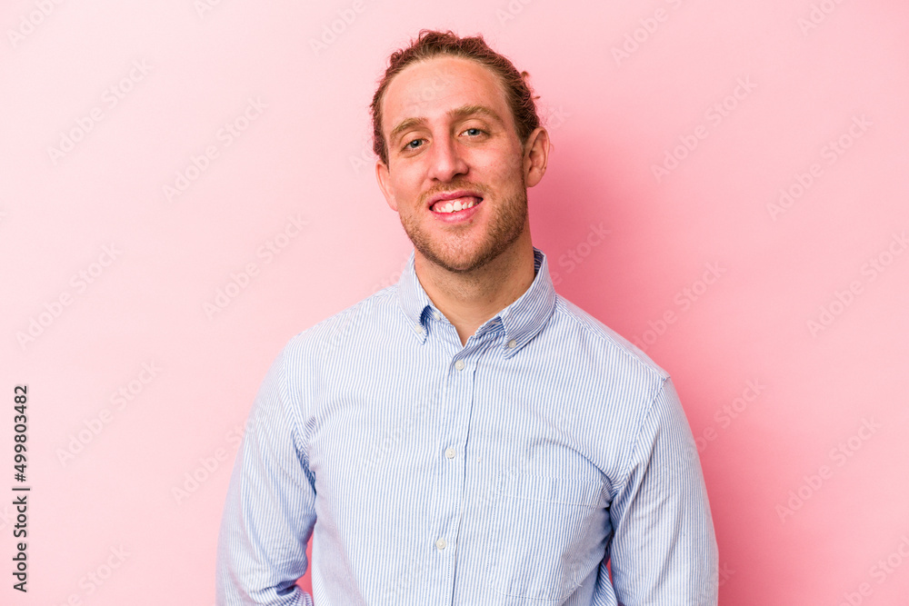 Young caucasian man isolated on pink background happy, smiling and cheerful. Young caucasian man isolated on pink background happy, smiling and cheerful.