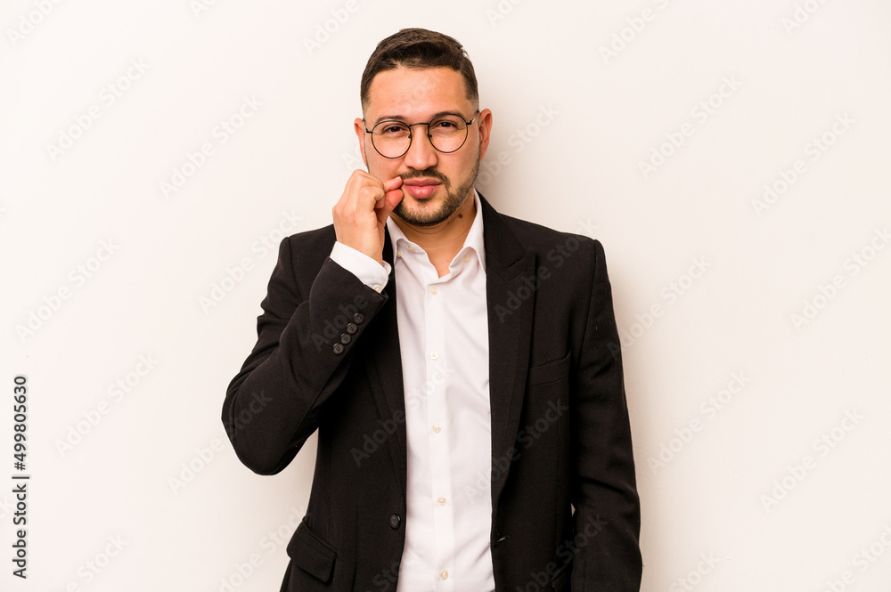 Business hispanic man isolated on white background with fingers on lips keeping a secret. Business hispanic man isolated on white background with fingers on lips keeping a secret.