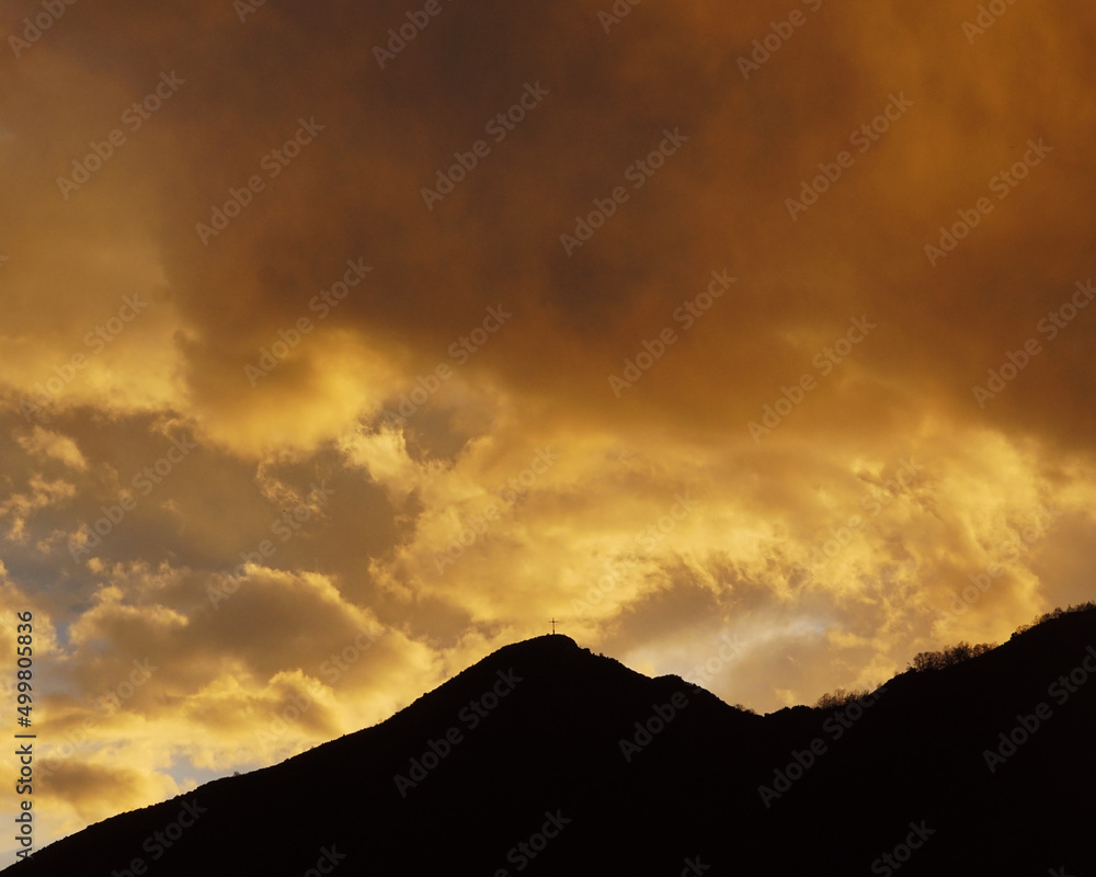 sunset in the mountains with storming clouds sunset in the mountains with storming clouds