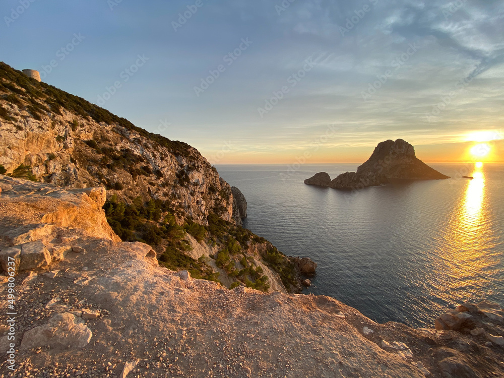 Sunset on the coast of Ibiza island with Es Vedra Sunset on the coast of Ibiza island with Es Vedra