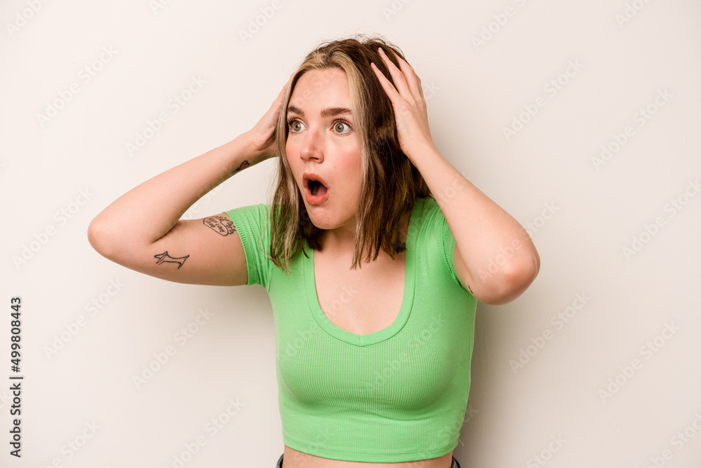 Young caucasian woman isolated on white background screaming, very excited, passionate, satisfied with something. Young caucasian woman isolated on white background screaming, very excited, passionate, satisfied with something.