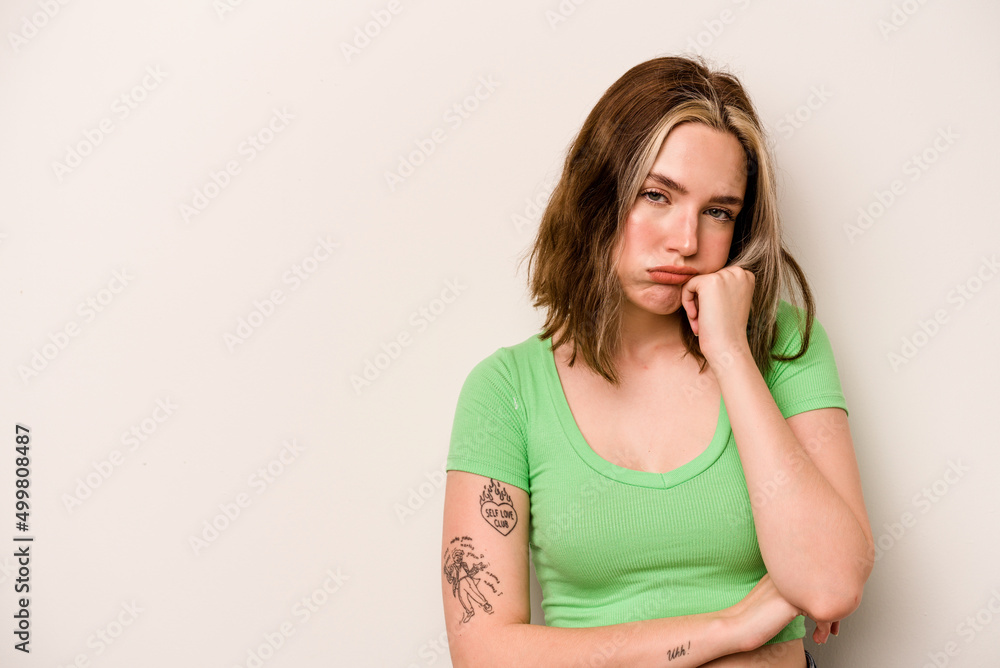 Young caucasian woman isolated on white background who feels sad and pensive, looking at copy space. Young caucasian woman isolated on white background who feels sad and pensive, looking at copy space.