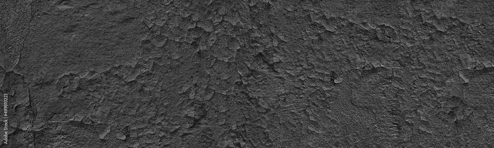 Old weathered black exterior wall wide panoramic texture. Cracked painted plaster. Dark gray grunge widescreen background