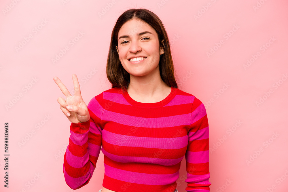 Young caucasian woman isolated on pink background showing number two with fingers. Young caucasian woman isolated on pink background showing number two with fingers.