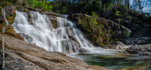 view of the Cascata Fecha de Barjas waterfalls in the Peneda-Geres National Park in Portugal