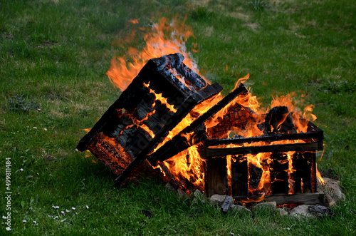 during the plague epidemic at apiary, it is necessary to ensure hygienic burning of all hives and tools that came into contact with sick bees. sad event and view of burning beekeeping equipment photo