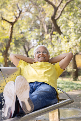Happy senior man relaxing at park
